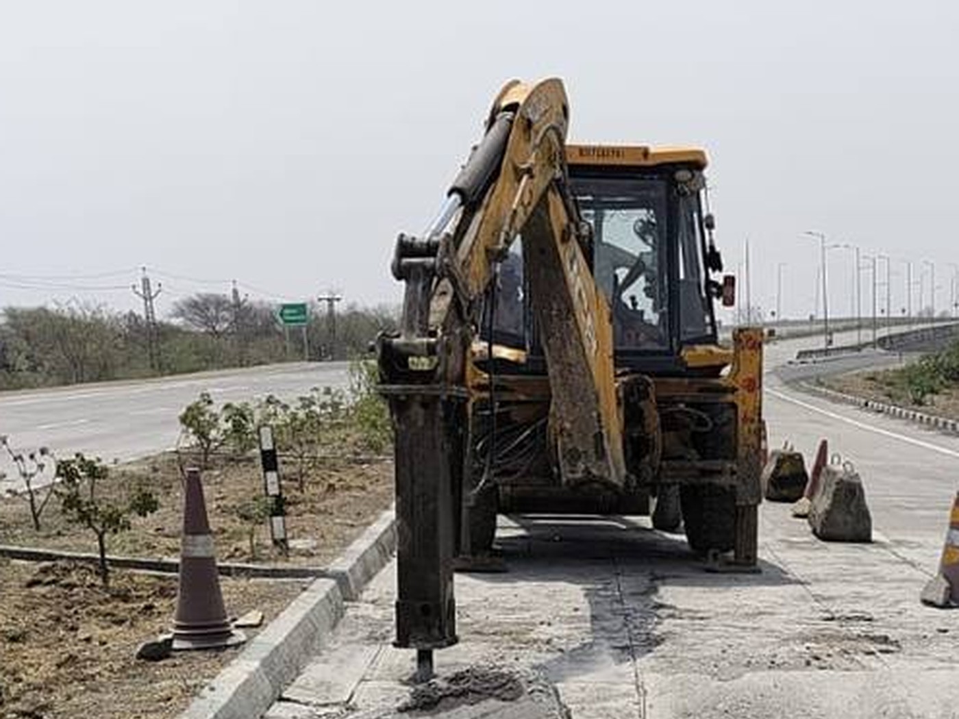 Excavation equipment preparing a road work area