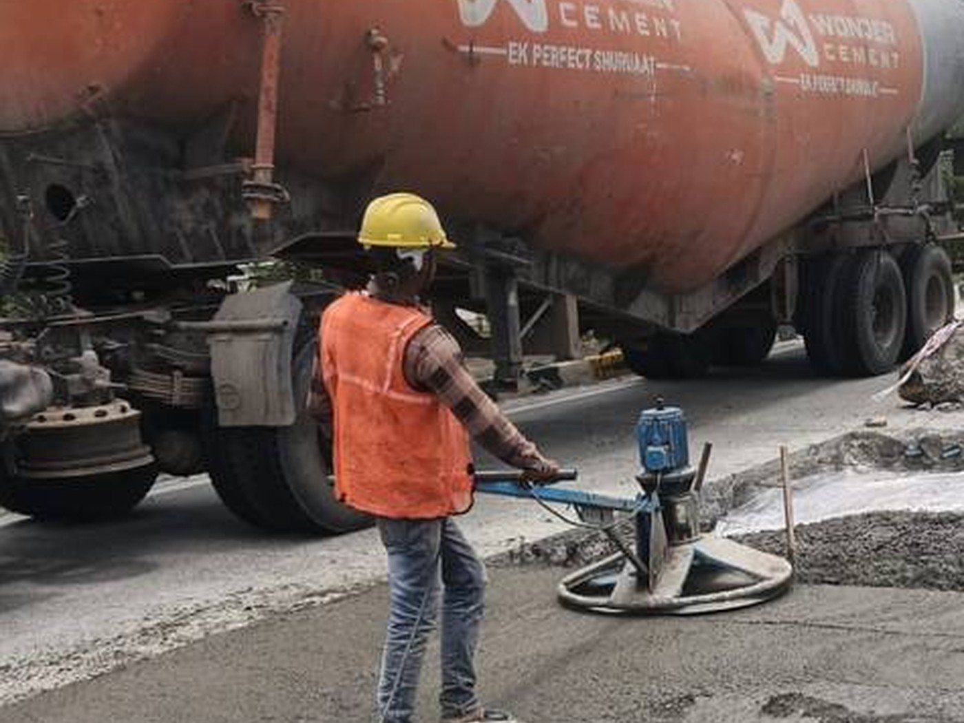 Concrete slab being placed and levelled